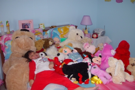 Kasen's bed is full of stuffed animals